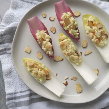 endive boat with cheese. apple and almond slice.