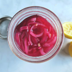 pickled red onion in a jar.