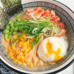 a bowl of chicken ramen noodle with egg and veggies closer look.