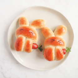 two cute bunny hot dog buns in a plate.