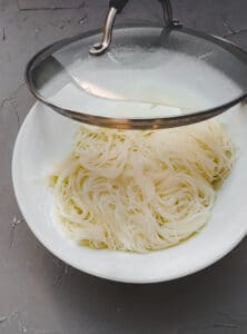 rice noodle in a white bowl with lid.