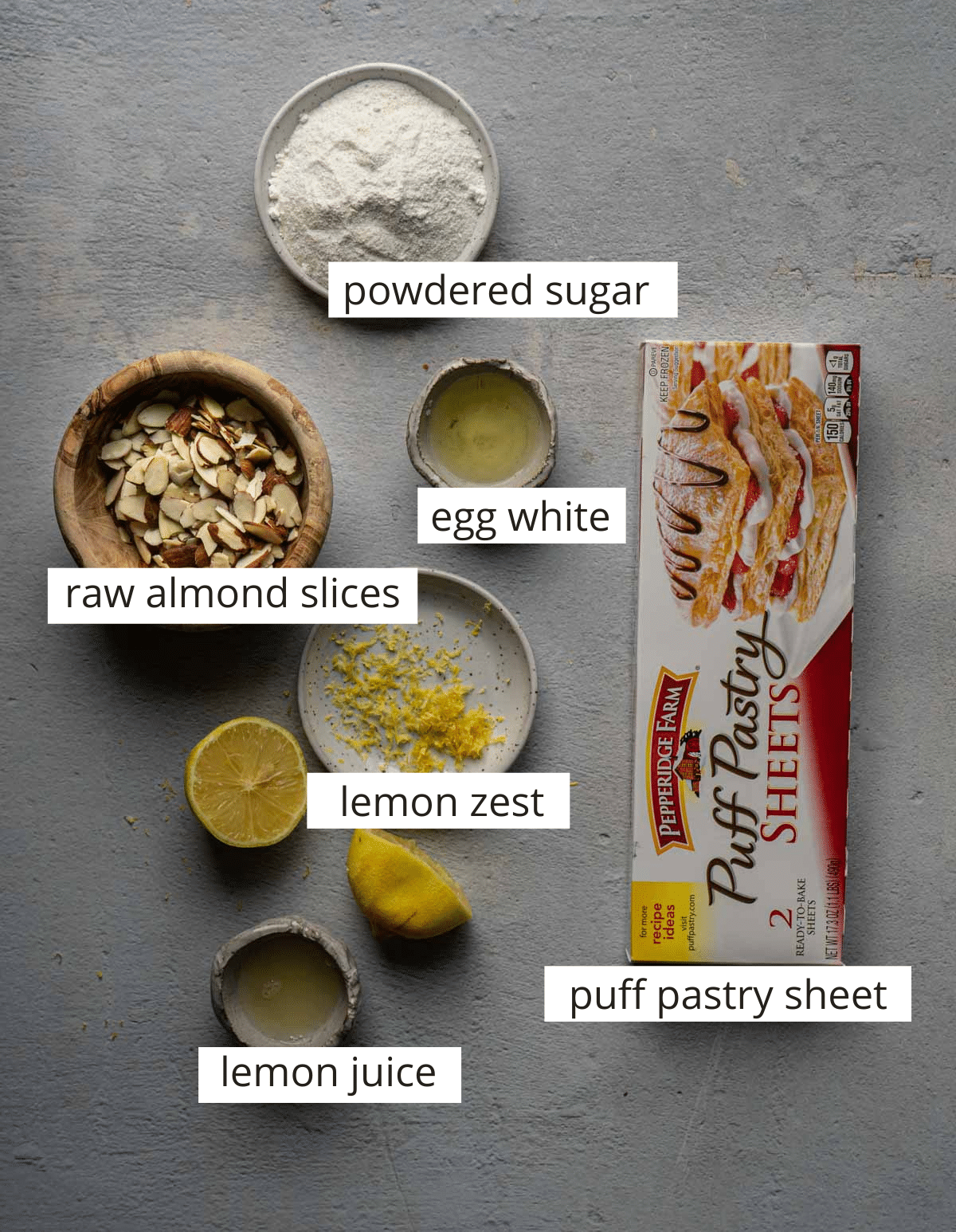 ingredients for making puff pastry almond cookies. 