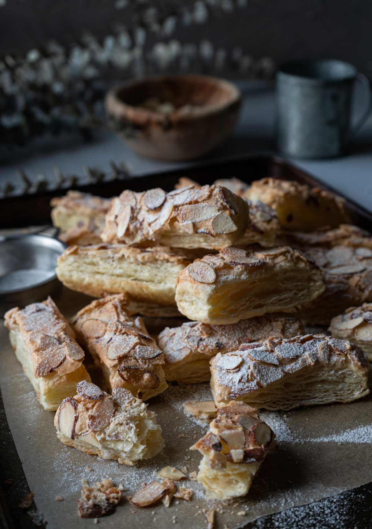 puff pastry almond cookie pile up in a baking tray. 