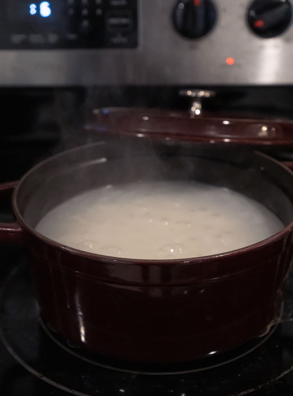 Cooking congee on the stove. 