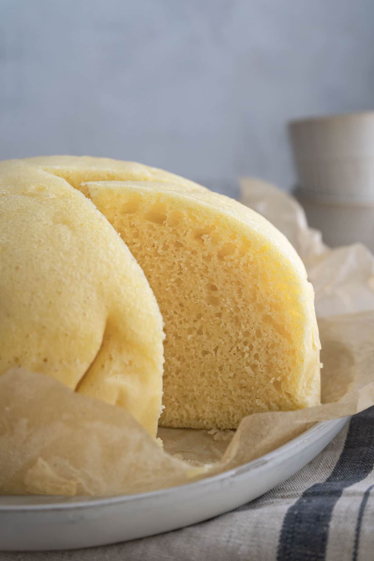 Chinese steamed cake on a plate lined with parchment paper. 