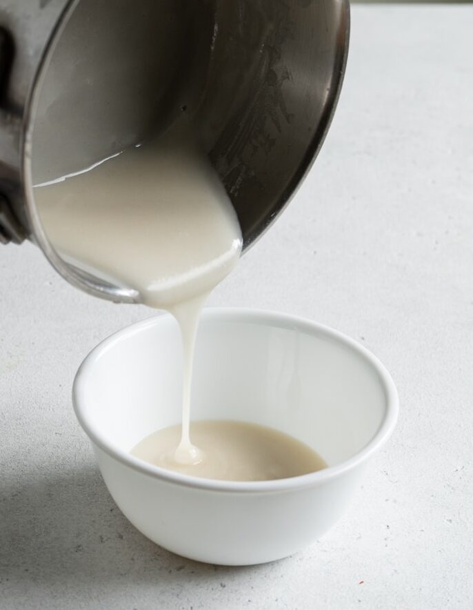 Tangzhong roux being poured into a bowl.